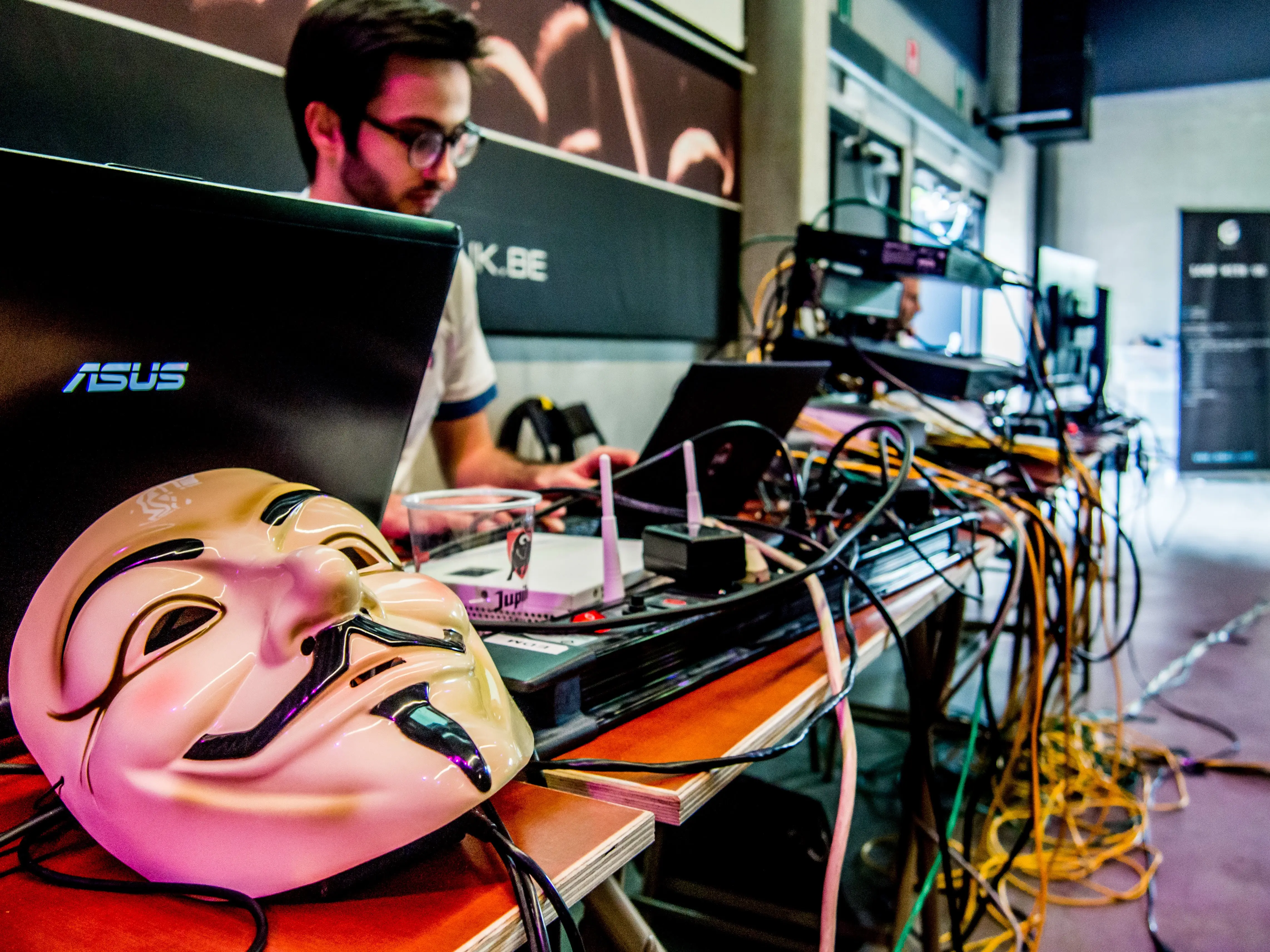 Staff is looking at the competition, with a Guy Fawkes mask at the front of the desk